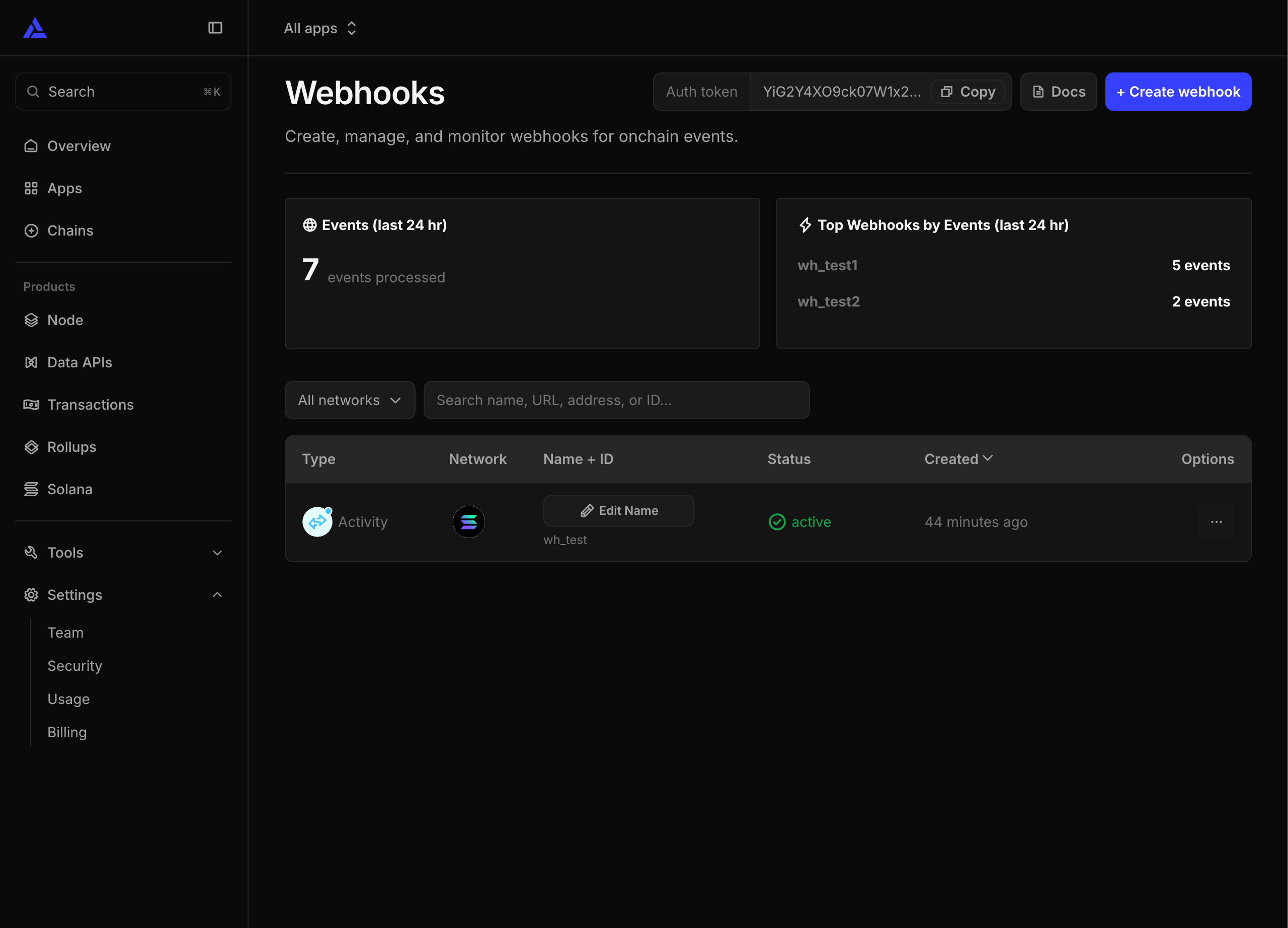 The Auth token and its Copy button sit in the header of the Alchemy Webhooks page.